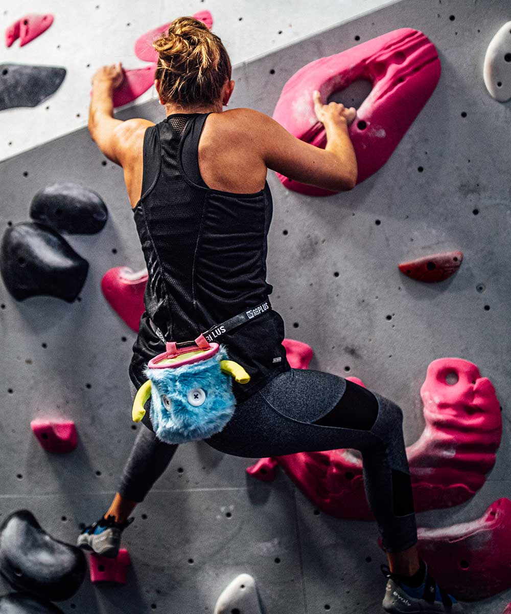 Chalk bag in action—attached to harness during outdoor bouldering session